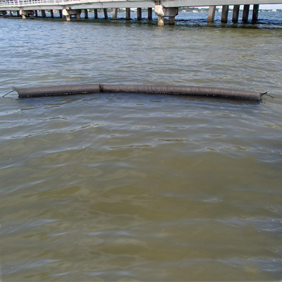 Type 1 turbidity curtain deployed in the water near a bridge