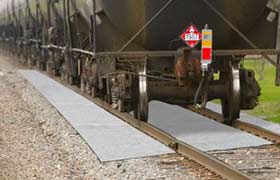 Ultra rail mat installed on a rail line under a train